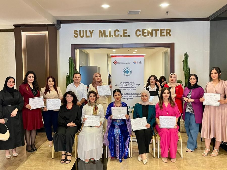 Graduates of the Lean In program with their certificates.